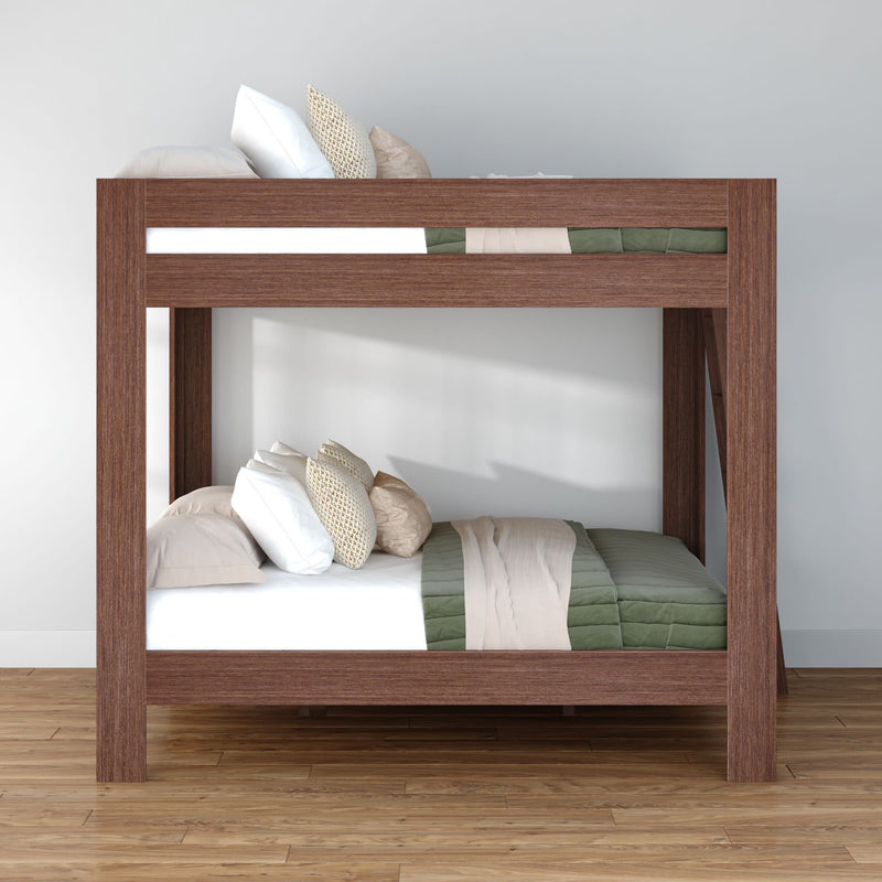 Modern solid wood bunk bed with green and beige bedding in a minimalist bedroom, space-saving loft-style sleeping solution on hardwood floor