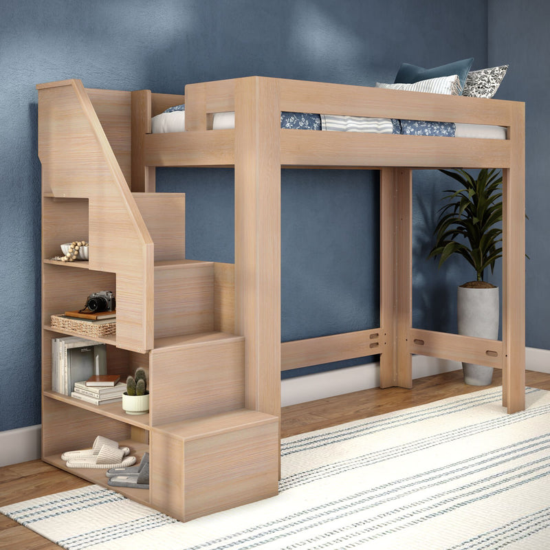 Light wood loft bed with built-in staircase storage shelves, blue accent wall, potted plant and striped rug — space-saving wooden loft bed for kids' bedroom