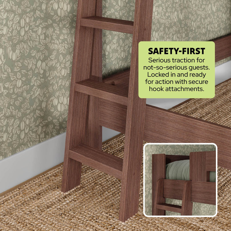 Solid wood bunk bed ladder with secure hook attachments and traction steps next to green floral wallpaper and woven jute rug