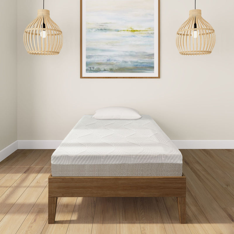 Single bed with modern mattress in minimalist bedroom featuring wooden floor and artistic wall art.