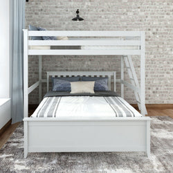 White wooden bunk bed with a full-size bottom and twin-size top in a modern bedroom with brick wall backdrop, featuring a stylish rug.
