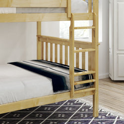 Wooden bunk bed with ladder and patterned blanket in a cozy bedroom setting.