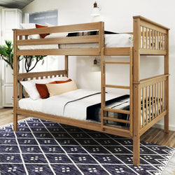 Wooden bunk bed with white linens and colorful pillows in a modern bedroom setting.