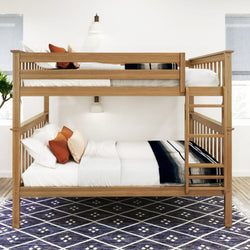 Wooden bunk bed with modern bedding, pillows, and a stylish rug in a bright bedroom.