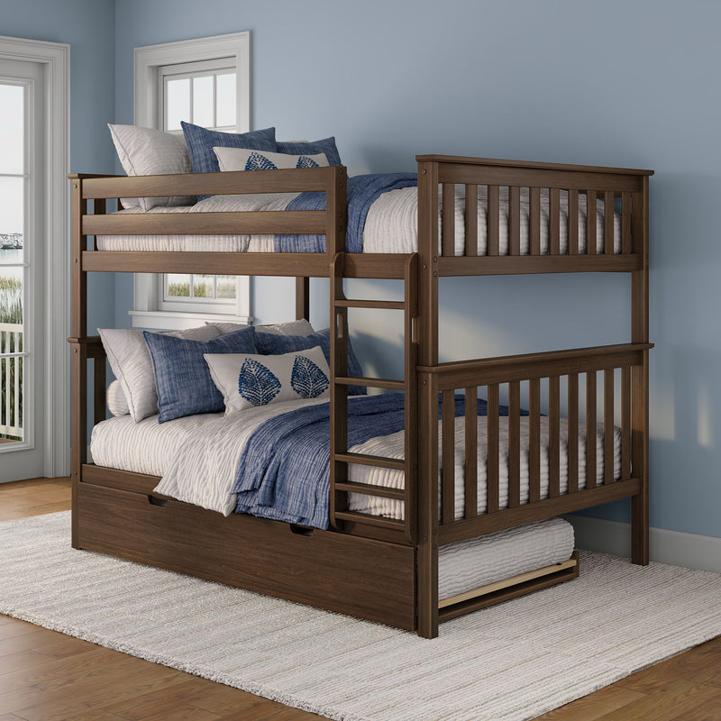 Dark wood two-level bunk bed with ladder and pull-out trundle drawer, styled with blue and white coastal bedding in a light-blue kids' bedroom