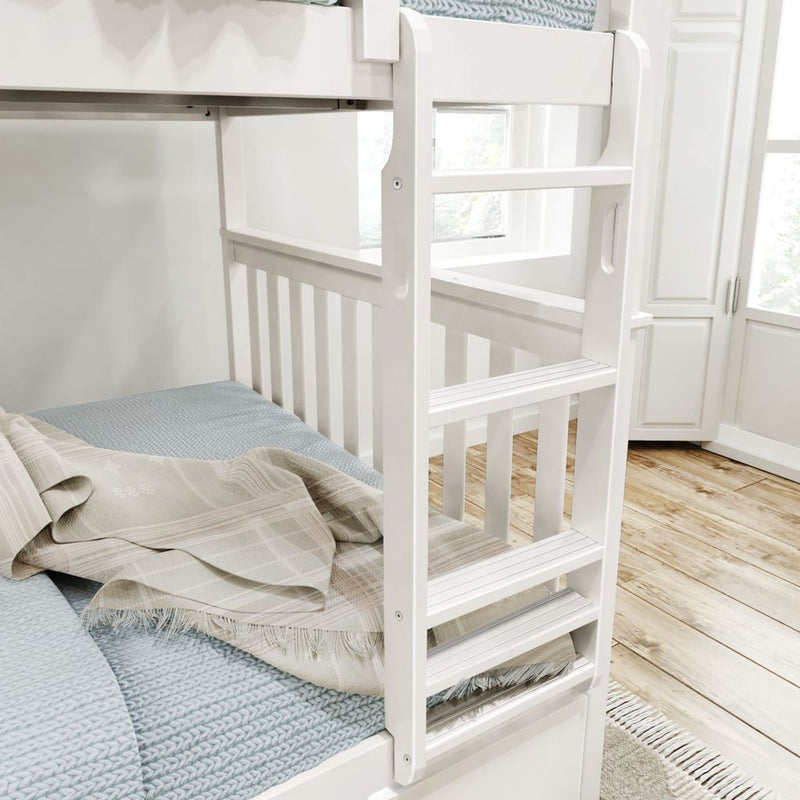 White wooden bunk bed with light blue bedding and plaid blanket in a bright bedroom.