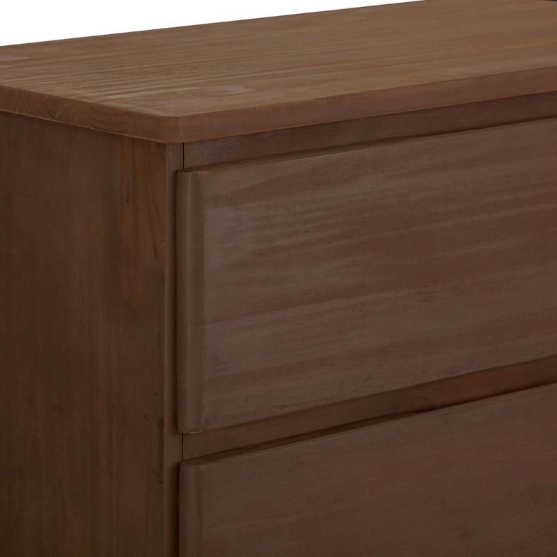 Natural wood texture dresser corner with smooth surface and minimalist design.