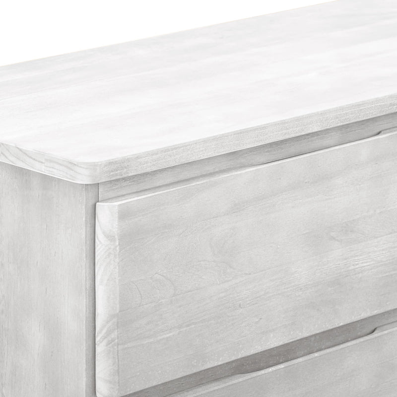 Whitewashed wood dresser close-up showing drawer front, rounded edges and integrated handle — modern farmhouse bedroom storage