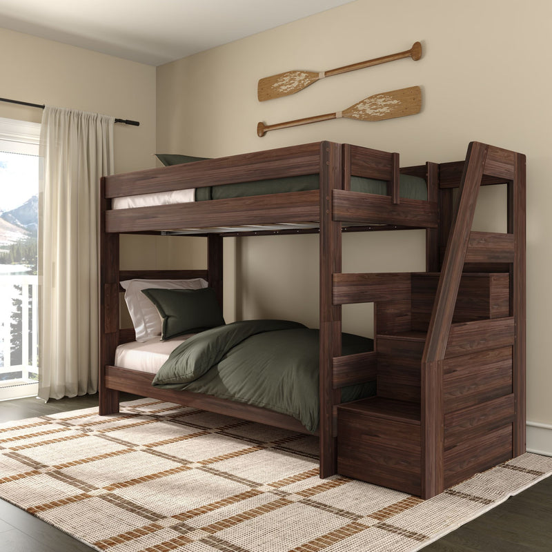 Rustic wooden bunk bed with green bedding and ladder in cozy cabin bedroom with plaid rug, sheer curtains and decorative wooden oars