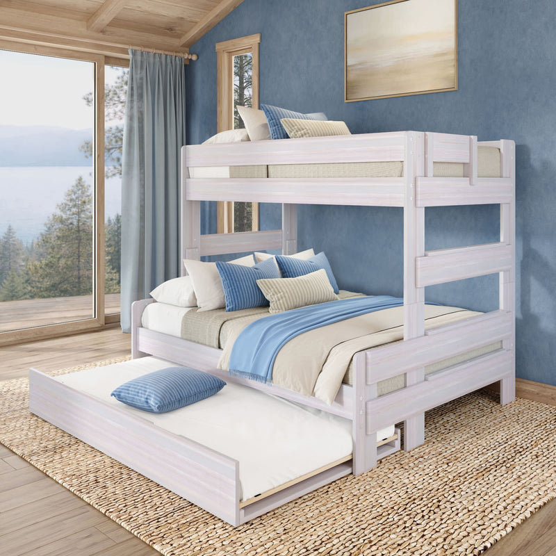 Whitewashed pine twin-over-full bunk bed with pull-out trundle, blue and beige bedding and pillows in a coastal-style bedroom with large lake-view window and natural jute rug, space-saving kids' bunk bed