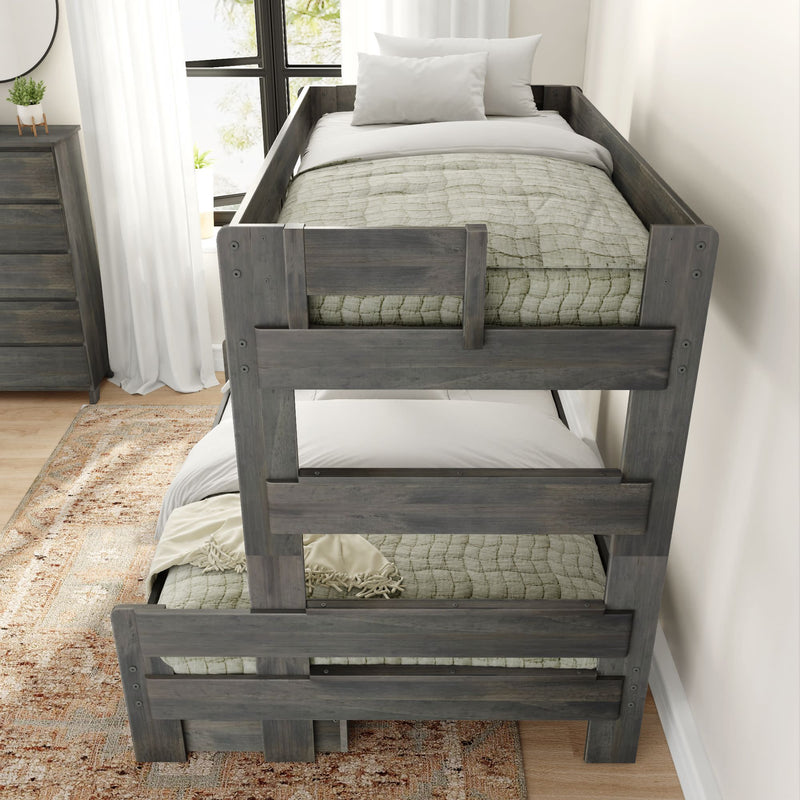 Gray wooden bunk bed in a modern bedroom with sunlight streaming through a window.