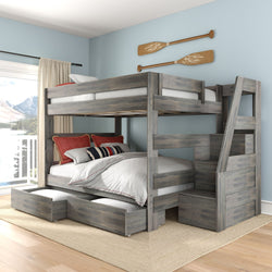 Rustic gray wooden bunk bed with built-in staircase and under-bed storage drawers in a coastal bedroom with light blue walls and decorative oars.
