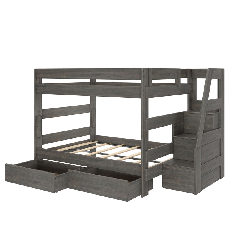 Gray wooden twin-over-full bunk bed with built-in staircase and integrated storage drawers, two under-bed pull-out drawers and slatted mattress frames, modern kids’ bedroom furniture