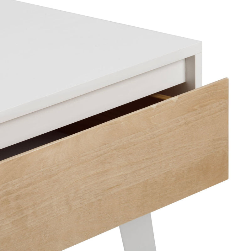 Modern white and natural wood desk corner with open drawer showcasing minimalist design.