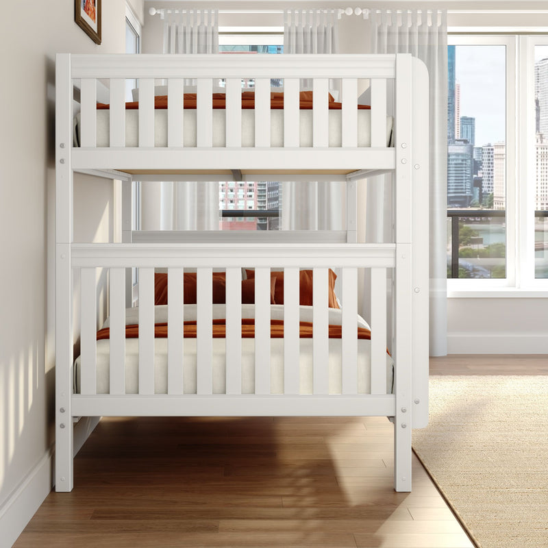 White wooden bunk bed in a modern bedroom with orange bedding, sheer curtains, large windows revealing a city skyline and hardwood floors