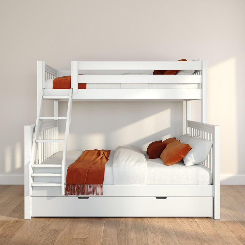 White wooden bunk bed with ladder and under-trundle drawer in a modern kids' bedroom, white bedding with rust-orange throws and pillows, neutral beige walls and hardwood floor bathed in natural light.