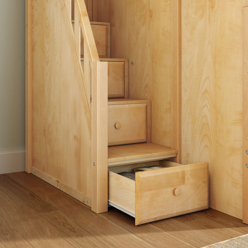 Built-in under-stairs maple wood storage drawers with open drawer and folded clothes, custom space-saving staircase storage