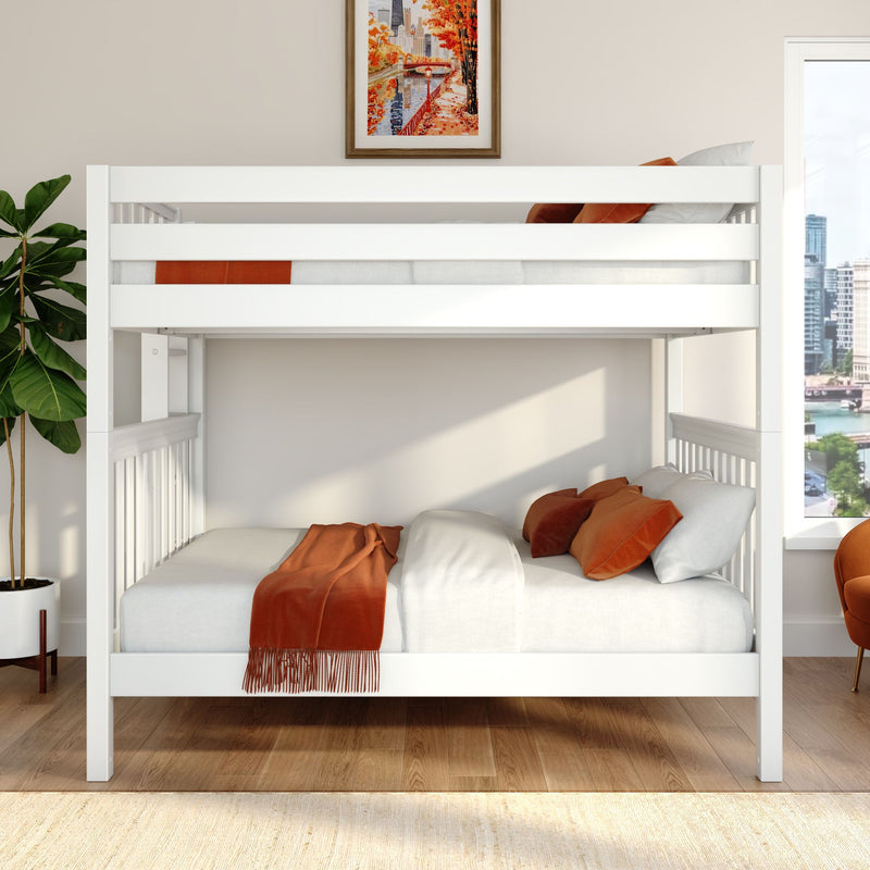 White modern bunk bed with white bedding, orange throw and pillows, hardwood floor, potted fiddle-leaf fig, framed autumn city print and window cityscape view