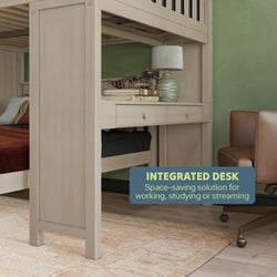 Integrated desk under bunk bed with lamp and books, ideal space-saving solution for working and studying.