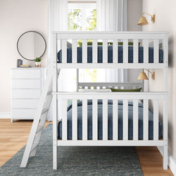White wooden bunk bed with blue bedding in a modern bedroom with natural light.