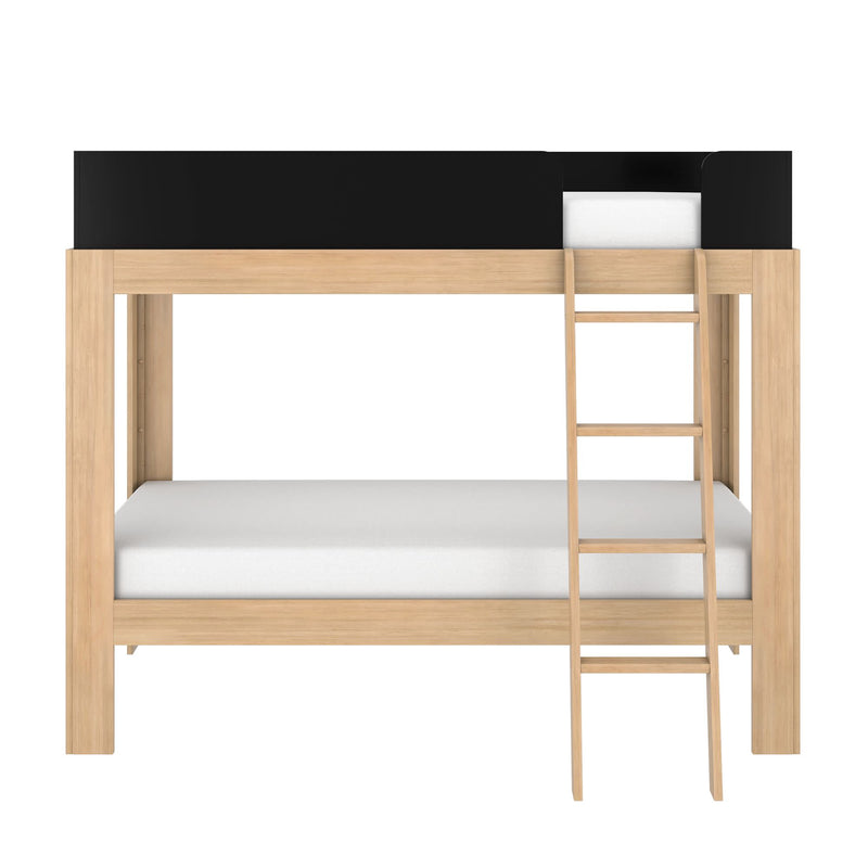 Natural oak twin-over-full bunk bed with black safety rails and wooden ladder — space-saving kids' bedroom furniture with white mattresses