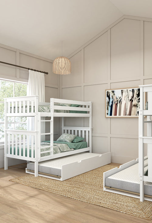 Modern bedroom with white bunk beds featuring green bedding, wooden flooring, and a woven pendant light.