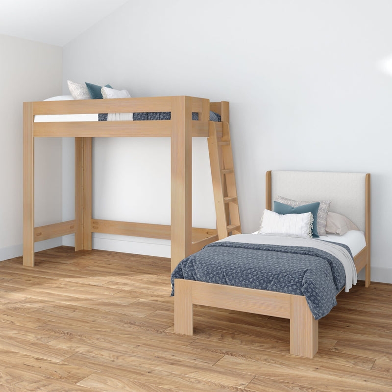 Modern minimalist bedroom with natural wood loft bed and matching single bed, blue patterned bedding, hardwood floors and white walls