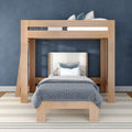 Modern light-wood loft bed with twin bed underneath, gray patterned bedding and decorative pillows against a navy blue wall on a striped rug — space-saving kids bedroom design