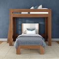 Modern wooden loft bunk bed with full-size lower bed, upholstered headboard, blue-gray bedding and navy accent wall in a styled bedroom interior