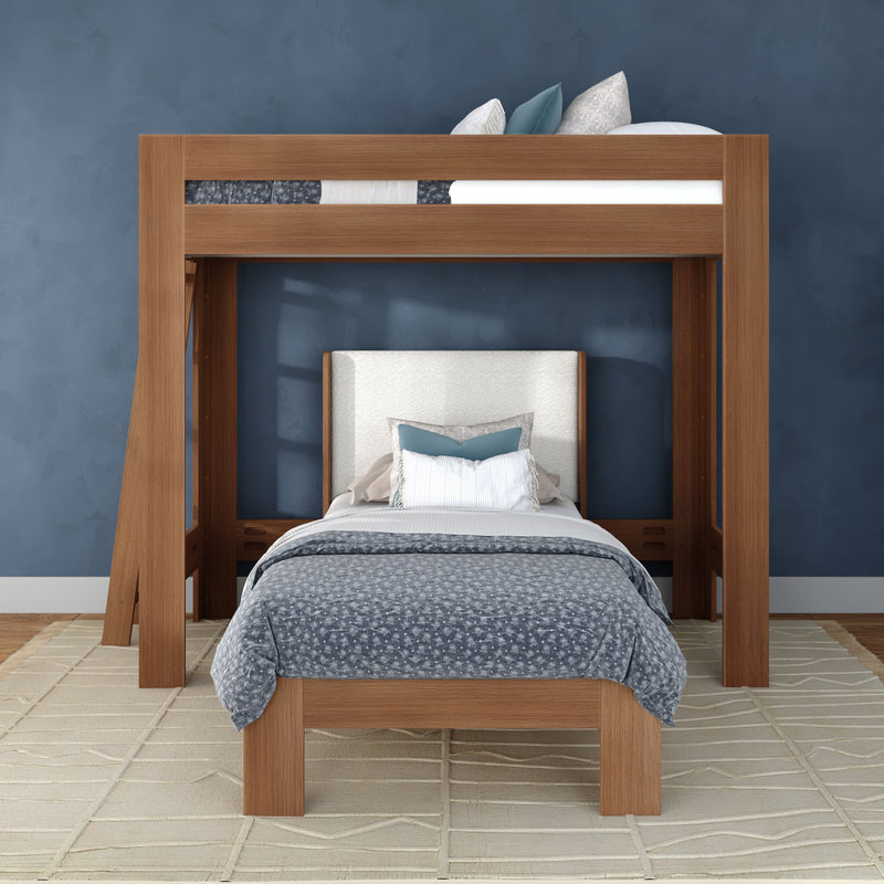 Modern wooden loft bunk bed with full-size lower bed, upholstered headboard, blue-gray bedding and navy accent wall in a styled bedroom interior