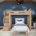 Modern light-wood loft bunk bed with built-in staircase, blue-and-white striped and floral bedding, navy blue accent wall, potted plant and ceiling fan in a stylish kids' bedroom