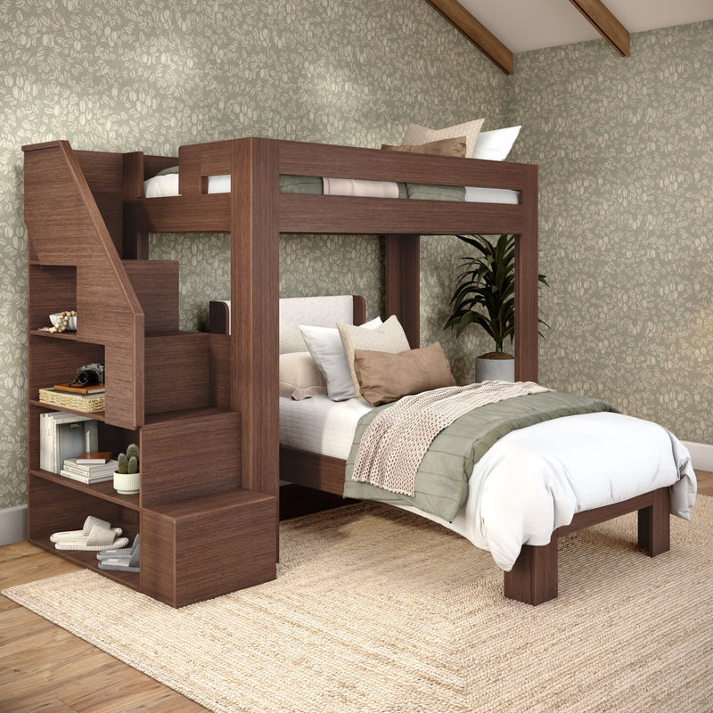 Wooden loft bunk bed with staircase and built-in shelves in cozy bedroom with green floral wallpaper