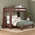 Solid walnut-finish wooden bunk bed with ladder, green quilted bedding and neutral pillows in a modern bedroom with patterned wallpaper and potted plant