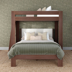 Modern walnut loft bunk bed with full-size lower bed, green quilted comforter, beige decorative pillows, floral wallpaper and jute rug, rustic bedroom design