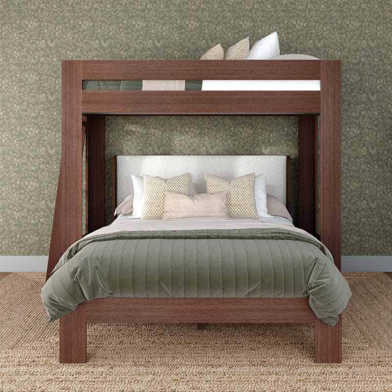 Modern walnut loft bunk bed with full-size lower bed, green quilted comforter, beige decorative pillows, floral wallpaper and jute rug, rustic bedroom design