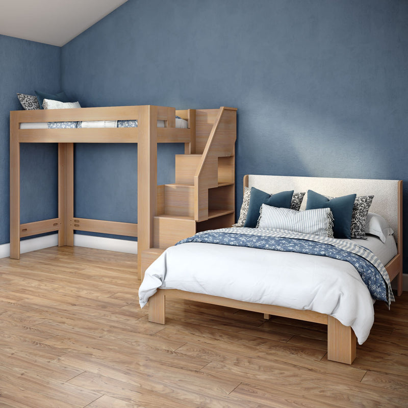 Modern bedroom with wooden loft bunk bed and staircase storage, double bed with navy and white bedding, blue accent wall and hardwood floor