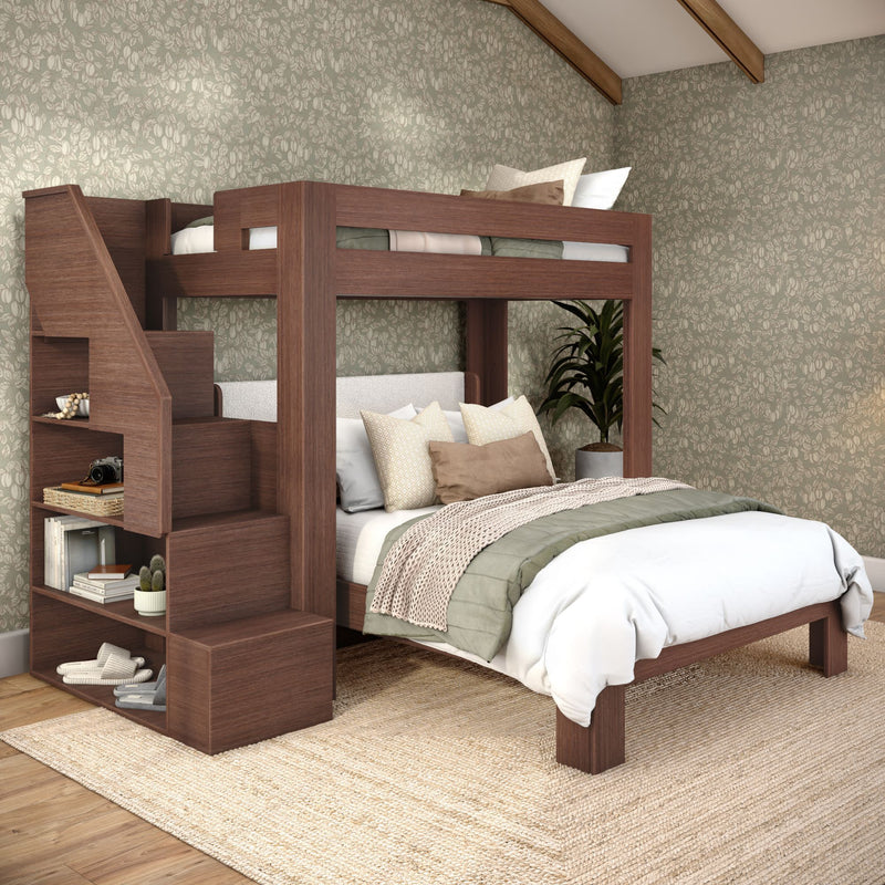 Walnut wood twin-over-full bunk bed with built-in staircase storage in modern bedroom, neutral layered bedding, green floral wallpaper and jute rug