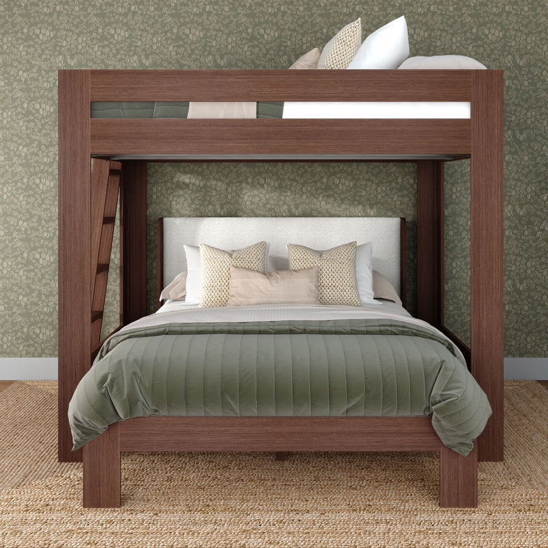 Modern wooden bunk bed with lower bed and upper loft, green quilted bedding, neutral decorative pillows, built-in ladder, floral wallpaper accent wall and jute rug — bedroom furniture interior