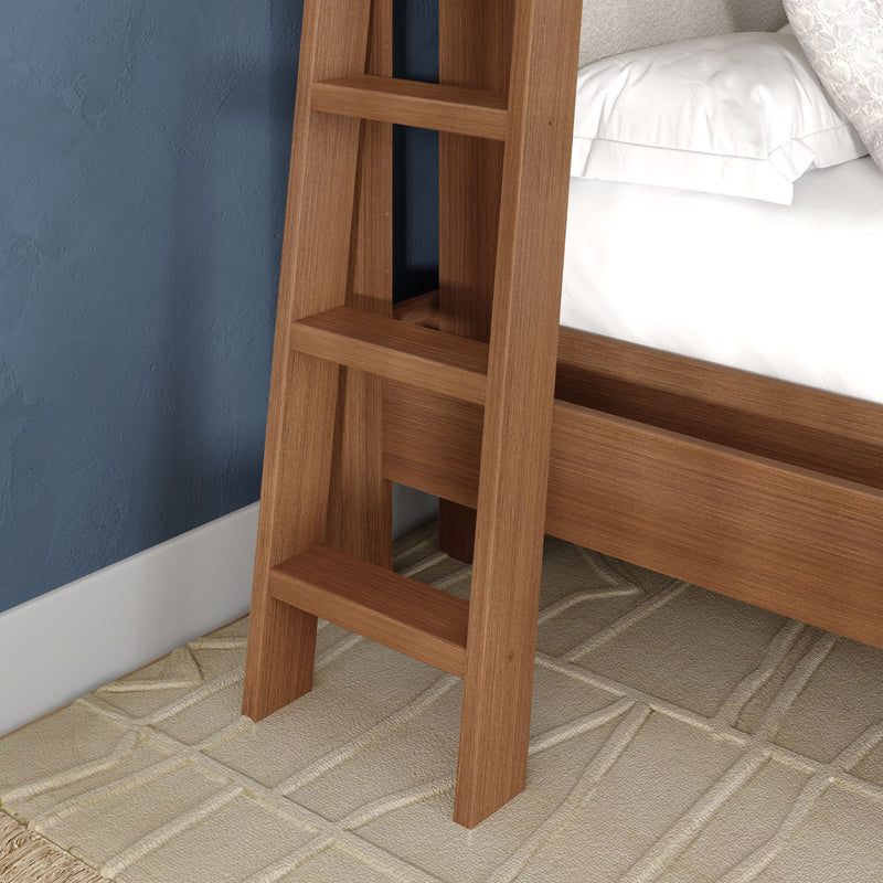 Wooden bunk bed ladder close-up — natural wood finish ladder attached to bed frame with white bedding, blue textured wall and beige patterned rug, modern bedroom decor