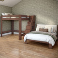 Wooden loft bunk bed with staircase and neutral bedding against green floral wallpaper in modern bedroom with hardwood floor