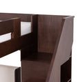 Dark brown wooden bunk bed with built-in stairs and storage shelves, close-up showing mattress edge and wood grain