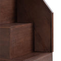 Close-up of dark walnut wood furniture corner showing rich wood grain texture and angled shelf detail