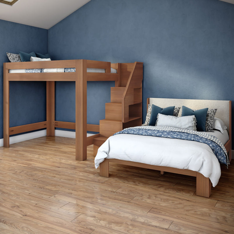 Modern kids' bedroom featuring a wooden loft bunk bed with staircase above a full bed, blue accent wall, decorative pillows and hardwood floors
