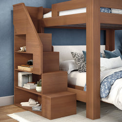 Wooden bunk bed with built-in storage staircase and open shelves, space-saving twin loft bed with blue floral bedding, decorative pillows and bedroom decor