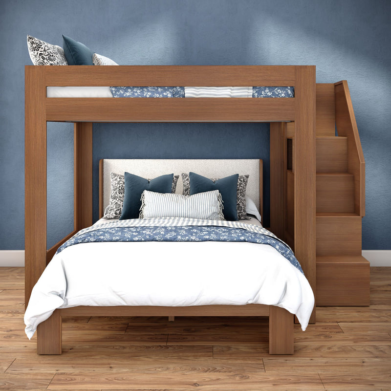 Modern wooden bunk bed with full lower bed and twin loft, built-in stairs, blue floral bedding on hardwood floor in stylish bedroom