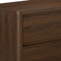 Dark brown wood dresser close-up showing walnut-finish drawers, rounded corner and natural wood grain texture — modern rustic bedroom furniture