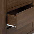 Close-up of an open dark brown wood dresser drawer with visible wood grain and metal drawer slides, modern rustic bedroom storage detail