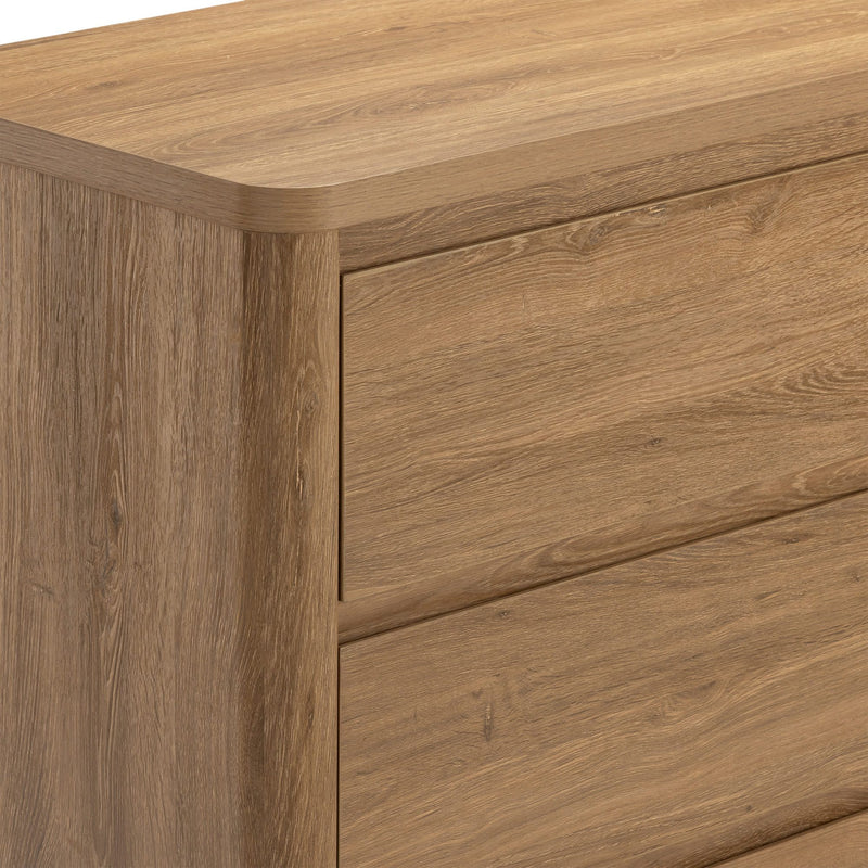 Close-up of modern oak dresser drawers showcasing natural wood grain and light oak finish