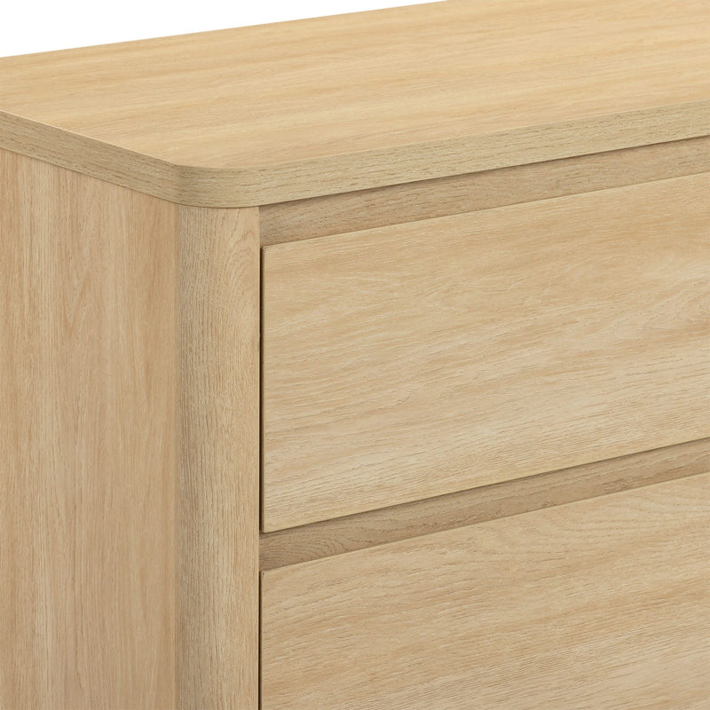 Close-up of light oak two-drawer dresser with natural wood grain finish and minimalist flat-front design for modern bedroom storage