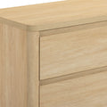 Close-up of light oak two-drawer dresser with natural wood grain finish and minimalist flat-front design for modern bedroom storage